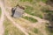 Old wooden barn on the edge of a field. aerial photo of rural area