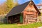 Old wooden barn with green door