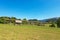 Old Wooden Barn and Hay Rack on a Green Meadow - Alps Slovenia