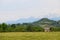 Old wooden barn in village in Caucasus mountains