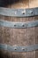 Old wooden barrel with gray metal circles