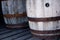 Old wooden barrels on a barn floor.