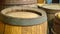 Old wooden barrels with metal hoops closeup.