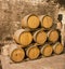 Old wooden barrels in the wine cellar of monastery