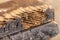 Old wooden beam affected by woodworm. Wood-eating larvae species beetle