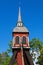 Old wooden belfry at the blue sky