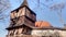 Old wooden belfry near the fortified church.