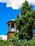 Old wooden belltower. Temple of the Dormition of the Theotokos