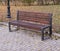 Old wooden bench in a autumn city part park. background, nature.