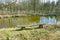 Old wooden bench and pond. Outdoor