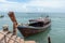 Old wooden boat anchored at Ao Nammao pier