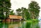 Old wooden boat house with thatched roof in an idyllic location on Lake Schwerin. Mecklenburg-Vorpommern Germany