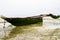 Old wooden boat during low tide, Indian ocean