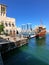 An old wooden boat moored to the pier of the fishing quarter of the old city of Dubai