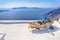 Old Wooden Boat on White roof in Thira Against The Aegean Sea and The Chain of Islands