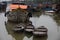 Old wooden boats and ships in channel in Asia. Vietnam.