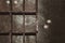 Old wooden box with cells. shelves in a black wooden rack. empty toolbox