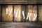 Old wooden box containing bottles of whiskey.