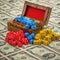 Old wooden box filled with game dice on a sheet of money