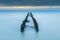 Old wooden breakwater at the beachat sundown,long time exposure photo