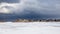 An old, wooden bridge crosses a section of frozen Georgian Bay waterfront in Collingwood