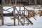 Old wooden bridge, the entrance to the river in winter, close up
