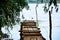 Old wooden bridge for fishing against the background of the river and green trees