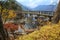 Old wooden bridge with leaves turning color in Yuno Lake - Nikko, Japan