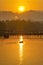 Old wooden bridge Mon Bridge in the middle of the river at sunrise