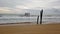 Old wooden bridge and strong wave in the sea beach