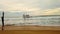 Old wooden bridge and strong wave in the sea beach