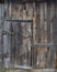 Old wooden brown door, brown boards, vintage decrepit texture