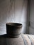 Old wooden buckets in whitewashed timber framed house serene light