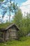 Old wooden cabin hut with overgrown roof, Hemsedal, Norway