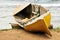 Old wooden canoe on beach