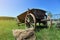 Old wooden cart in a green grass,wagon horse,Old wooden cart for