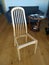 Old wooden chair without seat after repairing with lime and wood clamps