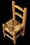 Old wooden chair with straw seat - Isolated on black