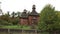 Old wooden church with a roof in the forest