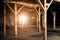 Old wooden columns. Old abandoned warehouse, illuminated by light from the window