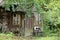 Old wooden cottage porch with broken windows