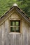 Old wooden cottage roof and window