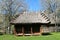 Old wooden country shed, covered with straw