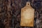 An old wooden cutting board on a black and brown wooden backgrou