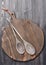 Old wooden cutting board and serving spoons