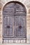 Old wooden decorated brown house door in Celleno  Italy