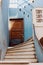 Old wooden door on blue plastered wall