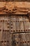 Old wooden door and coat of arms of the Holy Inquisition