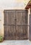 Old wooden door in the entrance stone house