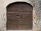 Old Wooden door with handle knocker and lock of medieval house